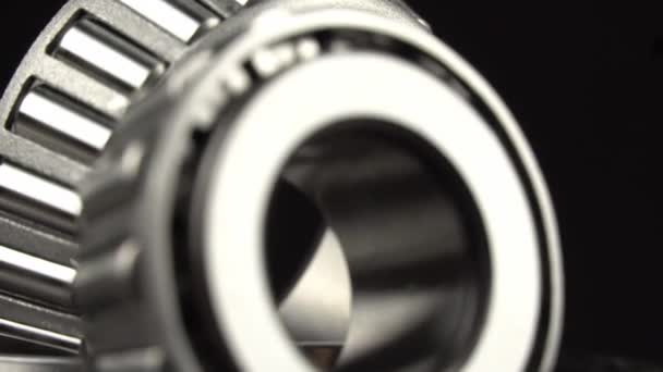 Cyclic seamless video with bearings rotating on turntable on a black background. — Stock Video