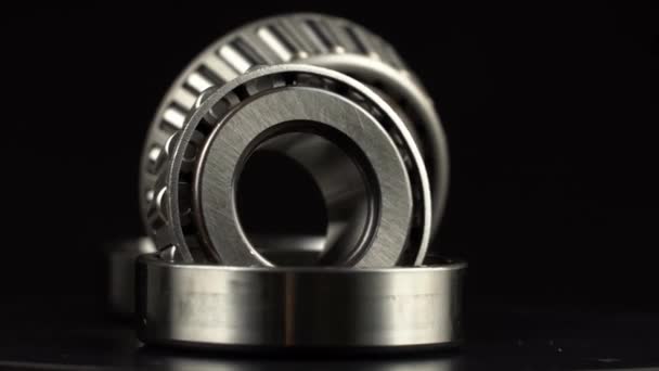 Cyclic seamless video with bearings rotating on turntable on a black background. — Stock Video