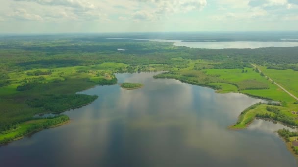 Flying over taiga forest lake. picturesque place, large lake surrounded forest — Stock Video