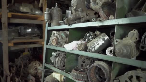 Used car parts on the factory shelf. Used auto parts for sale in the store — Stock Video