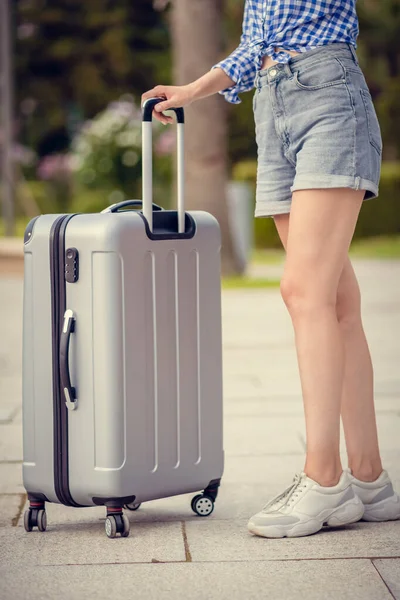 Young Slender Woman Shorts Shirt Standing Sideways Gray Suitcase Close — Stock Photo, Image