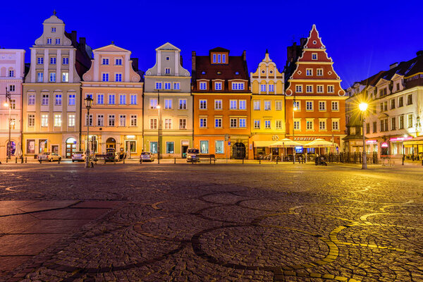 Wroclaw, Poland - October 14, 2019: Sightseeing of Poland. Salt square with bright colorful buildings in Wroclaw old town, beautiful night view