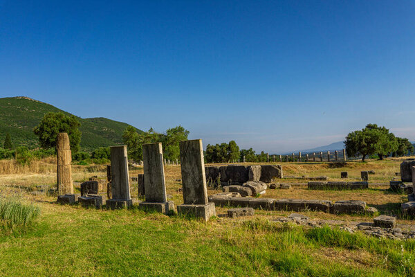 Messini, Greece - June 20 2021: Ruins in the Ancient Messene archeological site, Peloponnese, Greece. One of the best preserved ancient cities in Greece with visible remains dating back further than the 4th century BC.