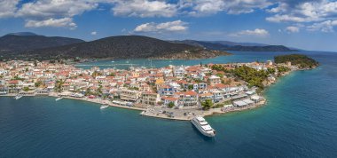 Aerial panoramic photo of picturesque seaside town of Ermioni built in peninsula with forest of Bistis at the end, Argolida, Peloponnese, Greece clipart