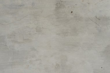 Çizik ve çatlaklarla dolu bir duvar parçası.