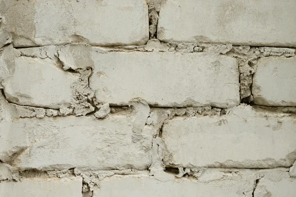 Textura de ladrillo con arañazos y grietas — Foto de Stock