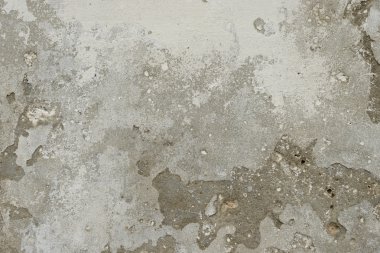 Çizik ve çatlaklarla dolu bir duvar parçası.