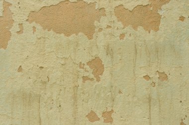 Çizik ve çatlaklarla dolu bir duvar parçası.