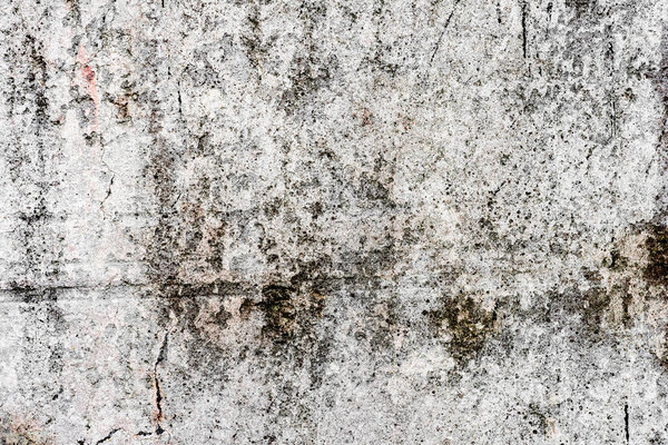 Текстура, стена, бетон, его можно использовать в качестве фона. Фрагмент стены с царапинами и трещинами