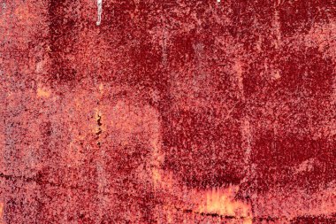 Çatlakları ve çizikleri olan metal bir duvarın dokusu arka plan olarak kullanılabilir.