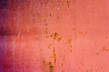 Çatlakları ve çizikleri olan metal bir duvarın dokusu arka plan olarak kullanılabilir.