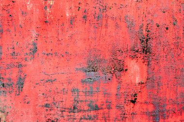 Çatlakları ve çizikleri olan metal bir duvarın dokusu arka plan olarak kullanılabilir.