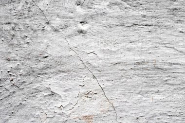 Doku, duvar, beton, arka plan olarak kullanılabilir. Çizik ve çatlaklarla dolu bir duvar parçası.