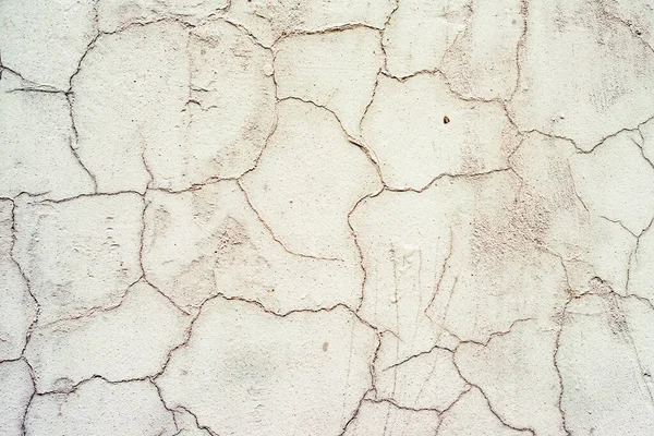 Doku, duvar, beton, arka plan olarak kullanılabilir. Çizik ve çatlaklarla dolu bir duvar parçası.