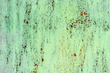 Çatlakları ve çizikleri olan metal bir duvarın dokusu arka plan olarak kullanılabilir.