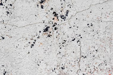 Doku, duvar, beton, arka plan olarak kullanılabilir. Çizik ve çatlaklarla dolu bir duvar parçası.