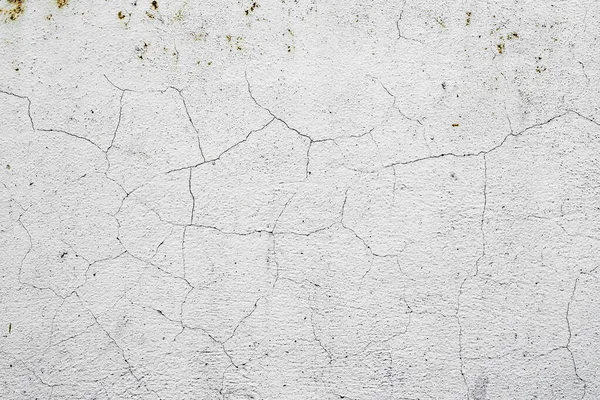 Doku, duvar, beton, arka plan olarak kullanılabilir. Çizik ve çatlaklarla dolu bir duvar parçası.