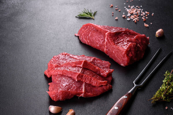 Fresh raw beef meat to make delicious juicy steak with spices and herbs. Preparation for grilled meat