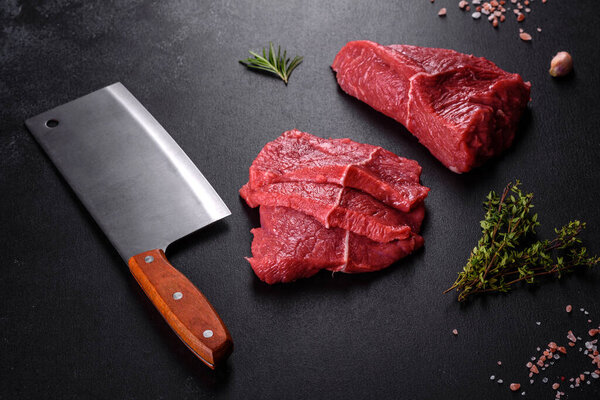 Fresh raw beef meat to make delicious juicy steak with spices and herbs. Preparation for grilled meat