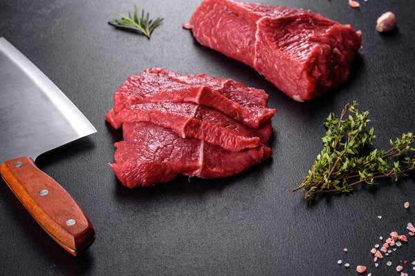 Fresh raw beef meat to make delicious juicy steak with spices and herbs. Preparation for grilled meat