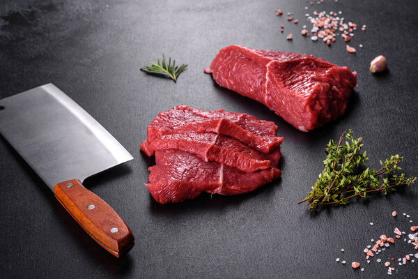 Fresh raw beef meat to make delicious juicy steak with spices and herbs. Preparation for grilled meat