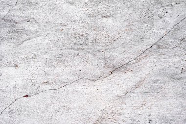 Doku, duvar, beton, arka plan olarak kullanılabilir. Çizik ve çatlaklarla dolu bir duvar parçası.