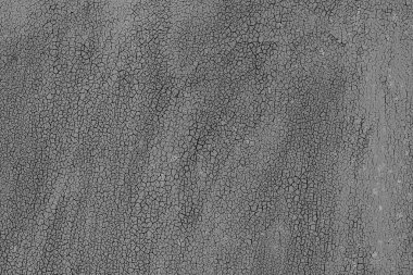 Çatlakları ve çizikleri olan metal bir duvarın dokusu arka plan olarak kullanılabilir.