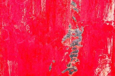 Çatlakları ve çizikleri olan metal bir duvarın dokusu arka plan olarak kullanılabilir.