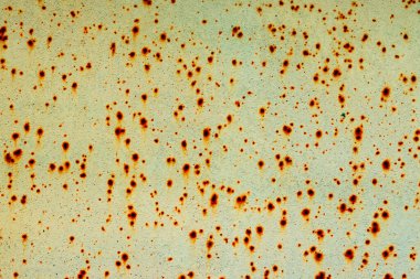 Çatlakları ve çizikleri olan metal bir duvarın dokusu arka plan olarak kullanılabilir.