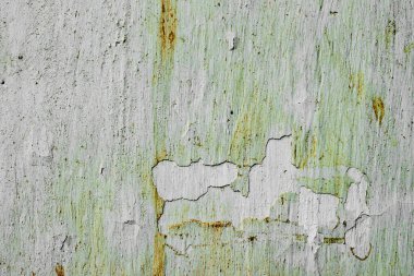 Çatlakları ve çizikleri olan metal bir duvarın dokusu arka plan olarak kullanılabilir.