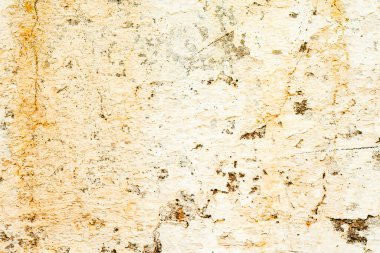 Çatlakları ve çizikleri olan metal bir duvarın dokusu arka plan olarak kullanılabilir.