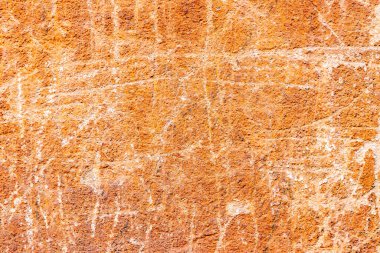 Doku, duvar, beton, arka plan olarak kullanılabilir. Çizik ve çatlaklarla dolu bir duvar parçası.