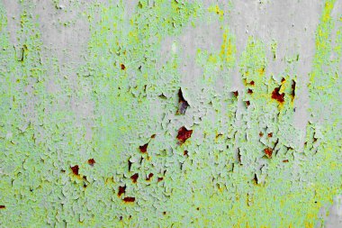 Çatlakları ve çizikleri olan metal bir duvarın dokusu arka plan olarak kullanılabilir.