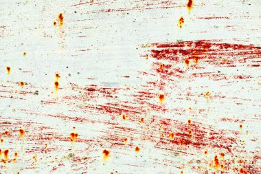 Çatlakları ve çizikleri olan metal bir duvarın dokusu arka plan olarak kullanılabilir.