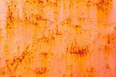 Çatlakları ve çizikleri olan metal bir duvarın dokusu arka plan olarak kullanılabilir.