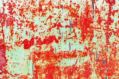 Çatlakları ve çizikleri olan metal bir duvarın dokusu arka plan olarak kullanılabilir.