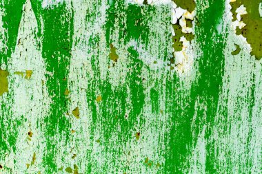 Çatlakları ve çizikleri olan metal bir duvarın dokusu arka plan olarak kullanılabilir.