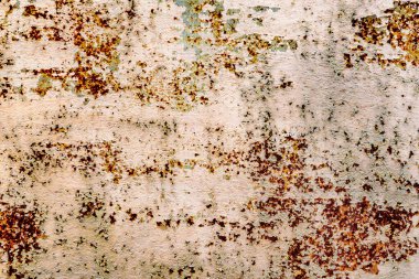 Çatlakları ve çizikleri olan metal bir duvarın dokusu arka plan olarak kullanılabilir.