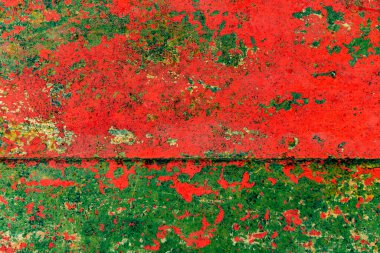 Çatlakları ve çizikleri olan metal bir duvarın dokusu arka plan olarak kullanılabilir.