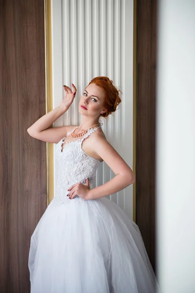 The beautiful girl in a wedding dress — Stock Photo, Image