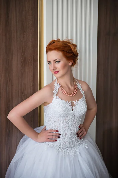 The beautiful girl in a wedding dress — Stock Photo, Image