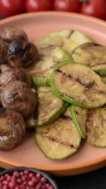 Grilled mushroom pieces, a vegetarian healthy meal with sauce. Barbecue mushroom halves