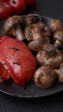 Grilled mushroom pieces, a vegetarian healthy meal with sauce. Barbecue mushroom halves