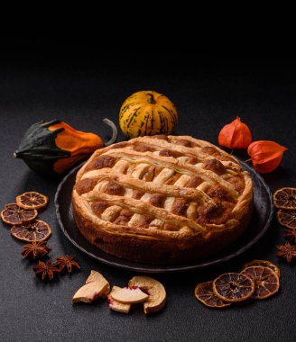 Sweet American pie with apples, pears, and cinnamon, a homemade dessert. Apple American pie as a food background for your design.