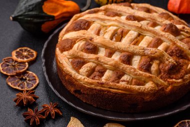 Sweet American pie with apples, pears, and cinnamon, a homemade dessert. Apple American pie as a food background for your design.