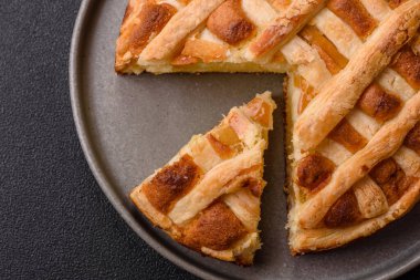 Sweet American pie with apples, pears, and cinnamon, a homemade dessert. Apple American pie as a food background for your design.