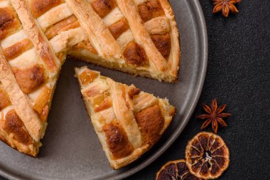 Sweet American pie with apples, pears, and cinnamon, a homemade dessert. Apple American pie as a food background for your design.