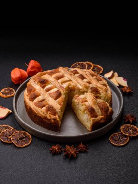 Sweet American pie with apples, pears, and cinnamon, a homemade dessert. Apple American pie as a food background for your design.
