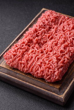 Raw ground beef for a burger or as an ingredient in a meat dish. Raw ground beef as a food background for your design