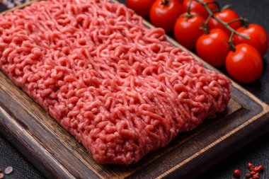 Raw ground beef for a burger or as an ingredient in a meat dish. Raw ground beef as a food background for your design